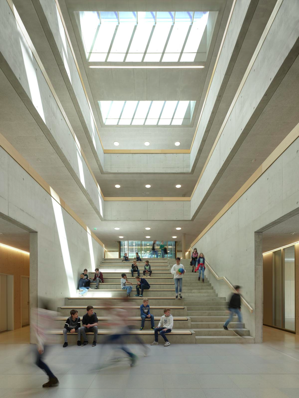 Kids playing in atrium with skylights, Gebhardschule