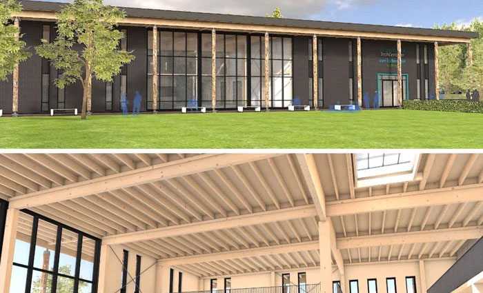 Moderne sportfaciliteit met grote ramen en een ruim interieur, VELUX-dakraam zichtbaar.